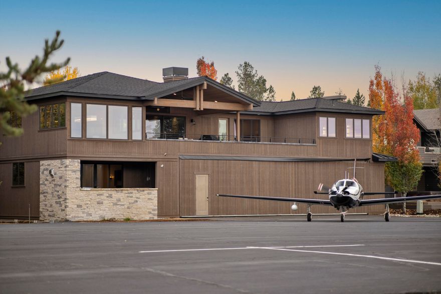 Stunning HANGAR home in Sunriver Resort! This newly completed home, located in the exclusive Sky Park area of Sunriver, presents a rare opportunity to own a luxury residence w/ taxiway access from Sunriver Airport for your aircraft to your hangar, surrounded by the scenic Deschutes River. The expansive great room features a wood ceiling, gas fireplace & captivating meadow views. The gourmet kitchen is a chef's dream, equipped w/ high-end oven/range, 2 dishwashers, pot filler, wine refrig, oversized refrig/freezer & spacious pantry. Outdoor living areas for relaxing in the hot tub or barbecuing while taking in the picturesque views. Four bedrooms, each w/ private baths, including a beautiful primary suite w/ wood ceiling, gas fireplace and luxurious bath w/ large shower & free-standing tub. Bonus room w/ wet bar is perfect for entertaining. Triple-car garage & hangar are a dream for all your toys, with or without an airplane. Sold furnished and ready for you to enjoy!