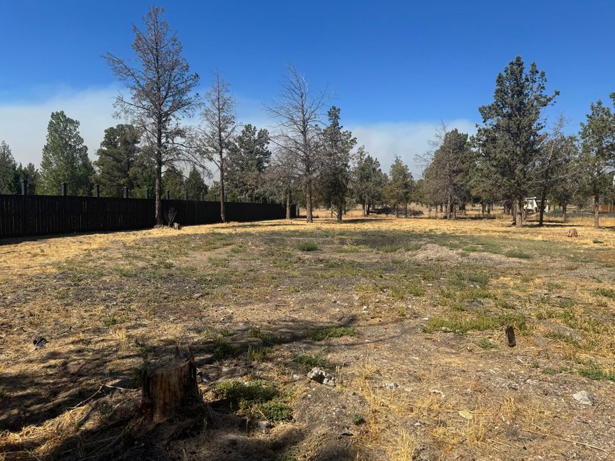 Beautiful level lot ready for your dream home! Discover this peaceful 1.04ac fenced and gated property located on a quiet cul-de-sac in desirable Crooked River Ranch. The level lot is ready for your custom home, with water and electricity already to the property. An existing building offers great potential to be converted back into a garage, plus there is a large shed providing ample storage. Mature trees add natural beauty and privacy, creating a serene setting to enjoy all the wonderful amenities Crooked River Ranch has to offer; from golf, parks, and trails to community events and nearby river recreation. Buyers to verify ALL info. Don't miss this opportunity to build your dream retreat in one of Central Oregon's most scenic and welcoming communities!