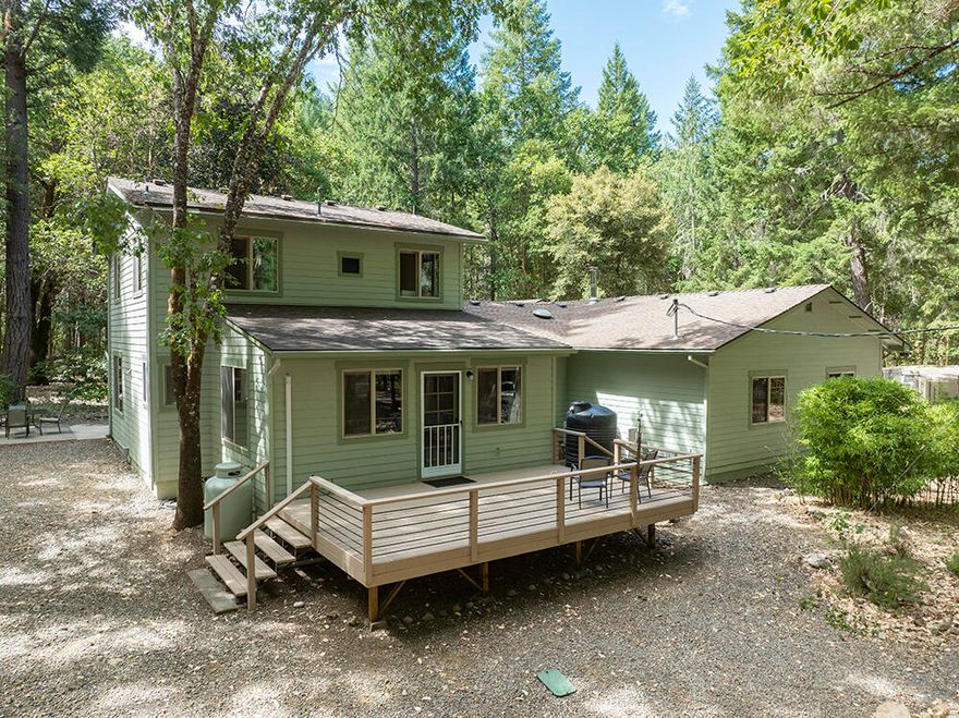 Incredible Home & Property on Year Round Deer Creek! 18+ Acres of End-of-the-Road Privacy with BLM on Two Sides. A Beautiful Forest & Spectacular Creek Frontage truly make this a One-of-a-Kind. Attractive & Welcoming Home that offers Open Living Space, a Comfortable Flowing Floor Plan, Extensive use of Natural Organic Materials, & a Light & Bright Interior. New Improvements include a Sunroom w/Incredible Swim-spa, 2nd Full Bath, & Fully Remodeled Kitchen! Level & Useable Property, Beautiful Landscaping, Walking Paths throughout, Established Garden & Fruit Trees. Wonderfully Managed Forest w/Impressive Trees. Attached Finished 2+ Car Garage w/Shop Space, Nearly Completed Highly Attractive Studio/ADU, & Log Carport made from Timbers on the Property! Deer Creek flows pristinely all year right through the Property. The perfect Home & Property in a Quiet & Private Setting! Direct Road Access to over 15,000 Acres of BLM & Forest Service Lands, with Roads, Hiking Trails, Creeks & Wilderness!