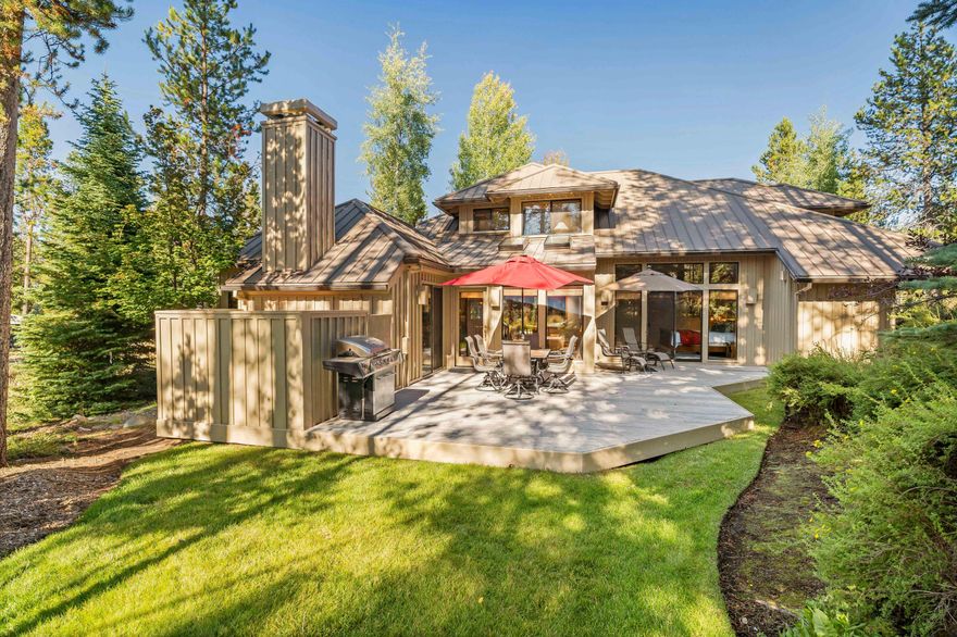 Tucked away on a beautifully landscaped corner lot, this custom-built Sunriver home by Sun Forest Construction is a true gem! The quality craftsmanship is evident throughout, with a durable metal roof, wood-wrapped windows, & stunning cedar ceilings. Enjoy peaceful mornings on the covered front porch or unwind on the private rear deck, surrounded by lush greenery. Inside, the open floor plan features a spacious kitchen w/ a breakfast bar, pantry, granite countertops, wine fridge, & stainless-steel appliances. The living room is bright & airy, boasting a vaulted ceiling & a cozy stone fireplace. The main level includes a primary suite with an updated bathroom and deck access, plus a versatile guest bedroom/den with a wood-burning fireplace. Upstairs, find a large loft area with a custom desk and cabinets, two additional bedrooms, & a full bath. With recent updates, including a new heat pump and water heater, plus SHARC paid in full.