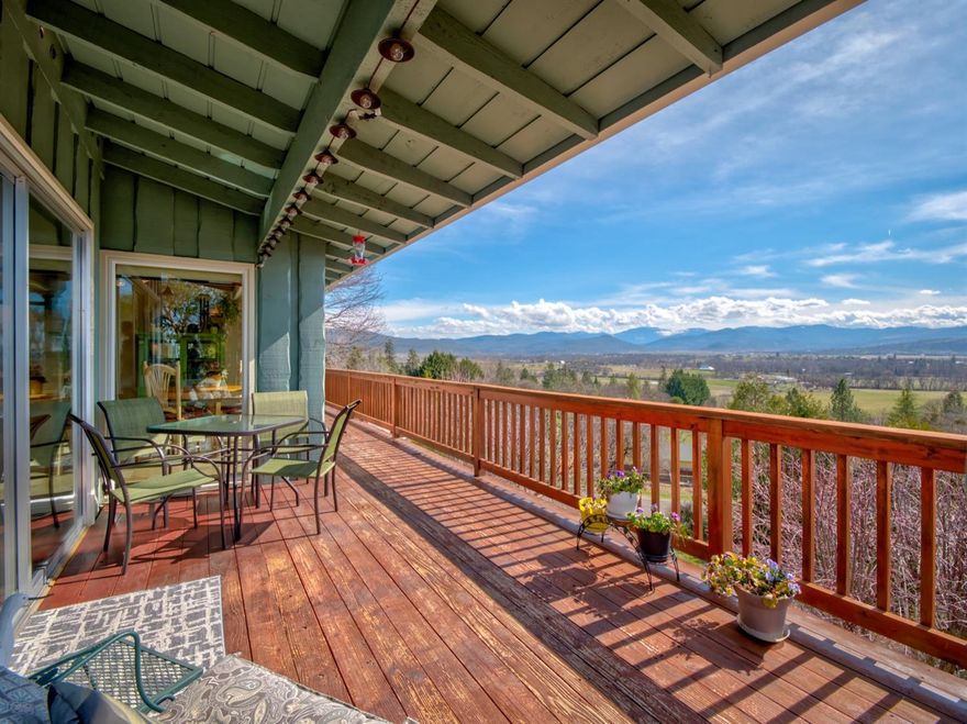 Views galore! Take in the sights from this 3-bedroom/2-bathroom home on a large lot. This home has been set up to enjoy the fantastic views from the deck, kitchen, and living room. Stay cozy with wood burning fireplaces in both upstairs living room and downstairs suite. Just rural enough to feel that peace and calm from the country, but close enough to town to enjoy nearby amenities. Recent upgrades include: New vinyl windows, interior doors, new AC unit and furnace, and upgraded insulation. This one is clean, tidy, and ready for new owners!