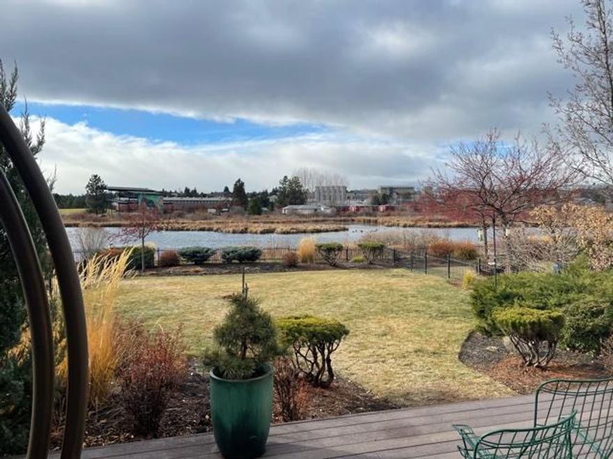 SOLD, for MLS Comps only. Rare Deschutes River waterfront town home with large fenced yard, situated across the river from the Les Schwab Amphitheater in the coveted Old Mill District.  Self standing structure (no common walls w/ neighbors). Only two of these self standing town homes exist in the Otter Run association. Great Cascade Mountain views, and home is situated fronting a popular walking/bike path paralleling the Deschutes River. Located adjacent to the Shops in the Old Mill.