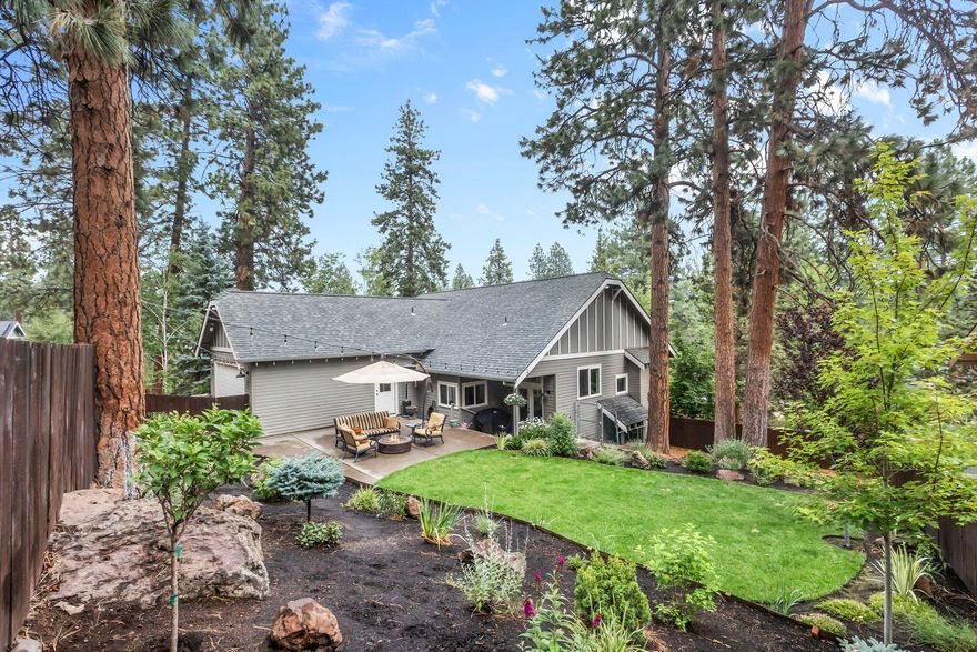 Discover this updated home in Bend's desirable Westside! Inside, the open floor plan features vaulted ceilings and large windows, creating an airy and inviting atmosphere. The great room includes a gas fireplace and hardwood floors that flow seamlessly into the dining area and kitchen. The kitchen is equipped with stainless steel appliances, ample counter space, and includes the fridge. Three bedrooms, including the primary suite, are conveniently located on the main floor. Upstairs, a spacious loft area offers additional living space, along with an extra bedroom and full bath. The large, fenced yard includes a generous patio area, perfect for outdoor gatherings. A double car garage with alley access adds to the home's convenience. Additional features include the washer, dryer, a whole house humidifier, a four-year-old roof, and fresh interior and exterior paint within the last two years. Agents-READ SHOWING INSTRUCTIONS.