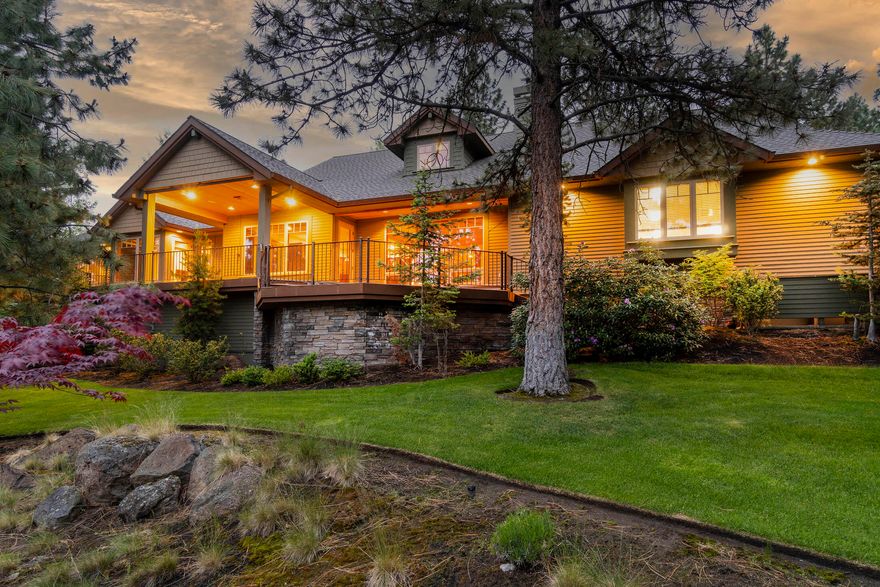 Privacy abounds in this custom-built single-lever stunner tucked among mature trees on Awbrey Butte. This finely appointed home features an open layout, vaulted ceilings, and wood doors, trim, and floors throughout. Enjoy high-end JennAir appliances, solar tubes, a built-in security system, and surround sound capability. An entertainer's dream with expansive decks to the west, accessible from the living room and owner's suite, this home boasts peekaboo mountain views and a stunning water feature that lights up at night. Don't miss the large three-car garage, complete with an electric car charging station, kitchen, and workshop area! Two full en-suites, plus lots of storage, and a beautifully landscaped yard add to the move-in ready appeal. Just around the corner from the community playground and park!