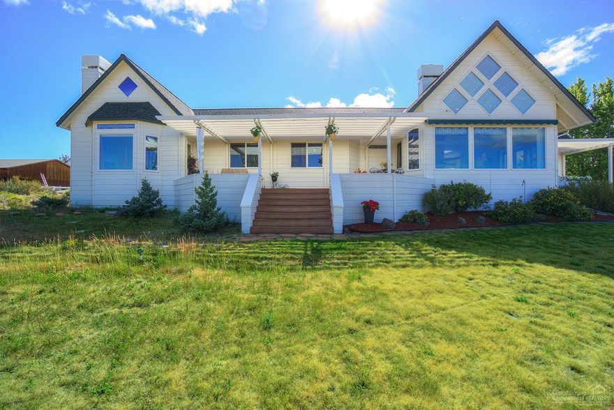 You will love the Cascade Mountain views from every room in this home. Built in 2000, with a wonderful drive through RV shop with full bath & laundry room. Open great room floor plan with cherry cabinets & granite in kitchen, vaulted ceilings, see through fireplace in the living & built in entertainment cabinet. Master boasts of his and her sink & closet set ups and a real wood burning fireplace with gas starter.Pond & underground irrigation, low maintenance native fescue. A/c plus 4 car attached garage.