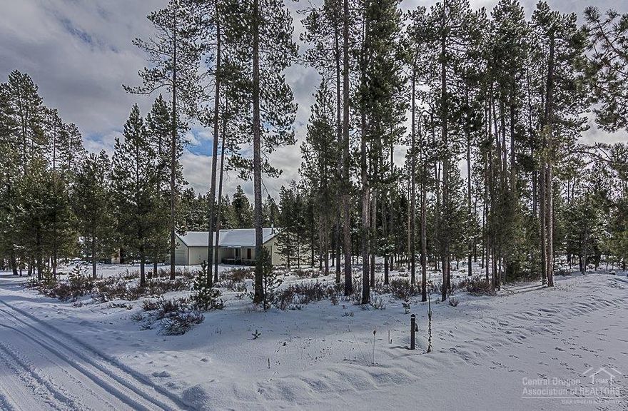 Nicely treed level lot, in a very quiet and private area- ready for you to build. You can have a manufactured home or construct a stick-built home. Community water & sewer connections at the street. Near community dock & boat launch, where owners have deeded access to the Deschutes River. Located near Sunriver, Mt Bachelor and National Forest Services lands & lakes.