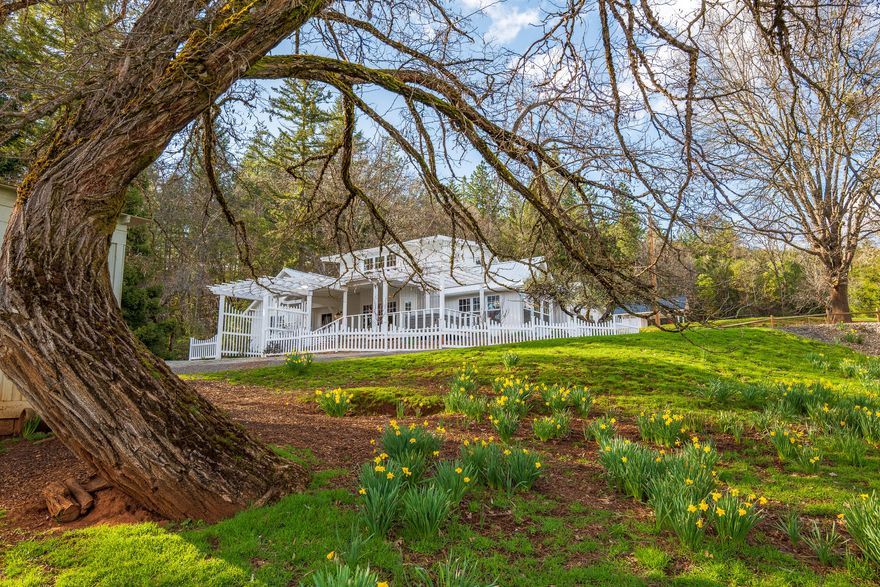Welcome to the McKenzie Homestead Ranch, a turn-key property that boasts an updated home w/koi pond, guest cottage, heated pool w/bathroom, shop w/loft, pastures, spring-fed pond, 2nd building site, & more. Plus, this breathtaking setting offers big sky views, privacy, & lots of usable space. The main home welcomes you w/ farmhouse charm & character, & features 4 bedrooms, 3 bathrooms, kitchen, dining, living room, library/office, & laundry - all w/beautiful modern updates & views from nearly every window. Outside the home is extensive outdoor living spaces such as a courtyard, decks, patio, & gardens. The guest cottage features a kitchenette, full bath w/laundry, & bedroom loft - also full of charming & authentic farmhouse finishes. There are also 2 horse stalls, a machine shed, and a 2nd tax lot that provides for a 2nd homesite - already improved w/a high producing well, power extended, & installed septic. This is a truly unique opportunity to escape to the country!
