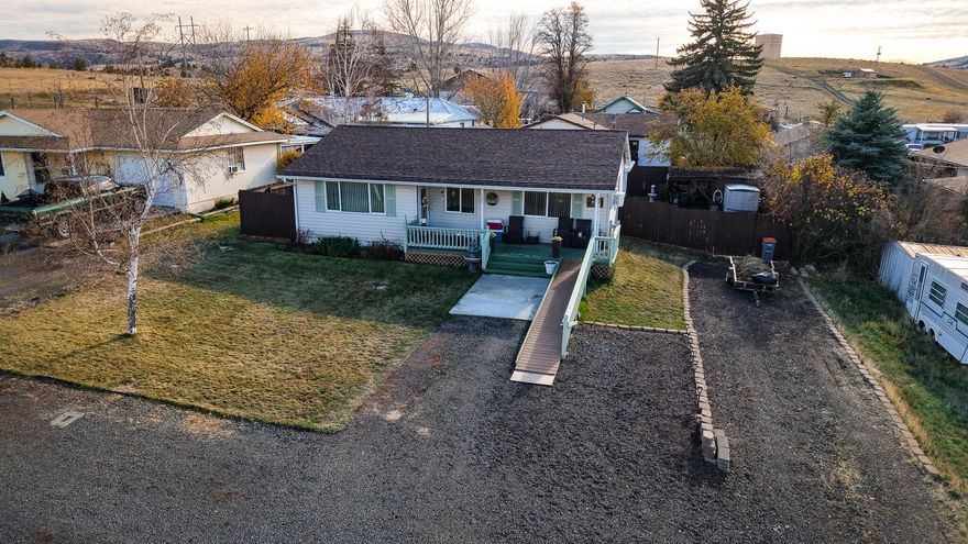 Discover this delightful three-bedroom, one-bathroom residence in Fossil! This well-maintained, 1,448-square-foot stick-built home features both a living room and a family room, electric forced air heating, and a warm propane fireplace. The front entrance and bathroom are ADA compliant, and this home is move-in ready. You can enjoy both the front and back decks for outdoor relaxation, and there is a fully fenced backyard on a manageable 0.13-acre lot. Conveniently located by downtown Fossil, this home is ideal for first-time buyers, retirees, or anyone looking for the tranquility of small-town living.

The electric panel was replaced about five years ago, and a new sewer line was installed in 2018. The composition roof is approximately 11 years old.