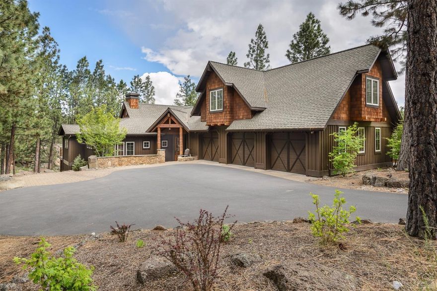 Contemporary meets lodge in this stunning West side home. Vaulted ceilings & grand windows create open, sunny spaces & a canvas for your own style. Gorgeous remodel w/ Wolf range, flooring, wall finishes, lighting, deck & more. Master, guest suite and office/ addl. bed on main floor; large bonus & 2 generous bedrooms upstairs. 3-car garage, heated dog run, partial heated drive. Gorgeous views of Awbrey Glen's signature hole & a scenic pond from this idyllic location within this private gated community.