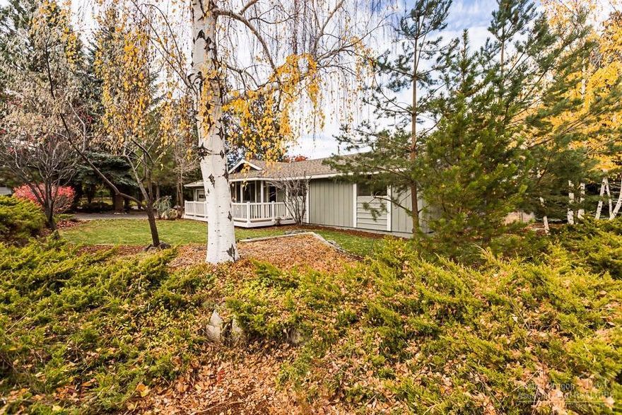 Remodeled 3 bedroom, 2 bath home. New paint, new kitchen, cabinets, tile counter tops, back splash, all new stainless appliances: range/oven, dishwasher, microwave, refrigerator. Large living w/gas fireplace opens to dining & kitchen. Master w/walk-in tub/shower. New laminate floors+new carpet in the bedrooms. You are going to love this quiet neighborhood-mature trees-corner lot. Abundance of storage & decking off the back. Oversized double car garage, plus additional garage/shop w/ 640 sqft. Room for an RV