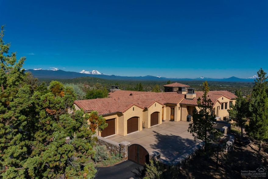 Exquisite European style home on 1 acre offers privacy, main level living, and beautiful Cascade views. Vaulted great room opens to a tranquil courtyard, perfect for relaxing and entertaining. Spacious chef's kitchen boasts 2 islands, 2 Bosch dishwashers, and cozy fireplace in the breakfast nook. Luxurious master suite wing on the main level, plus two en suite guest rooms and wine cellar on the lower level. A masterpiece of fine finishes & craftsmanship. Located on Bend's west side in spectacular North Rim.