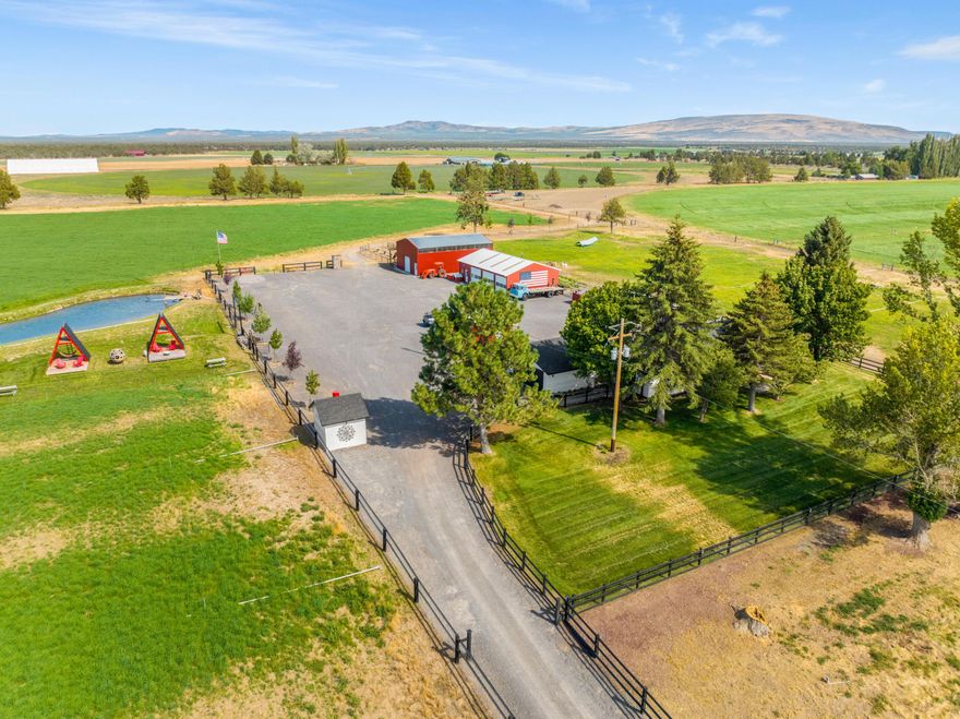 Just 15 minutes from Bend, this thoughtfully renovated ranch home is situated on 40 acres of tranquility w Cascade Mtn. views! This stunning home benefits from an extensive and meticulous remodel including windows, doors, roof, insulation, siding, paint, and flooring. This home boast a modern kitchen and bath(s), and the Mstr. suite is to envy. A detached office, 30x60 shop, and a new 30x50 barn complete this property, and the lush pastures yield 100 tons of Orchard Grass annually.  This fully renovated hobby farm is your chance to escape the hustle and bustle of city life and embrace a simpler lifestyle. The centerpiece of the property is the meticulously restored farmhouse, where you will be greeted by an abundance of natural light warming the Great Room and open floor plan so thoughtfully designed. Whether you dream of raising livestock, cultivating a bountiful garden, or simply enjoying the peace and tranquility of nature on acreage, this hobby farm will exceed your expectations!