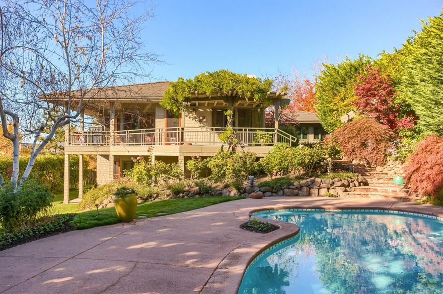 Exceptional quality custom home w/expansive views of the Rogue Valley. Award winning landscape design welcomes you to a well thought-out, spacious, & open 4,441' SF 4 bed, 3.5 bath home - could be featured on pages of Arch. Digest or Better Homes magazines. Located on .43 acre lot, exclusive & highly desirable neighborhood in area of high end homes. Perfect for entertaining, light/bright cust. Kitchen, SS appliances, incredible built-ins, pantry, breakfast nook, open dining w/fireplace, dry bar, rich Jara wood flrs., warm wood finishes & color tones, high ceilings, 2 living areas w/2nd fireplace, lrg. covered patio, hot tub, cust. pool, lush landscape, & peaceful setting. Luxurious main level master suite is spacious retreat w/fabulous views w/everything you would expect & more. Display art in natural light of gallery hall, den/office w/built-in cabinetry/work station, lower level family room. 4 bdrms-all spacious/2 bdrm. suites, amazing storage - additional 871' improved basement.