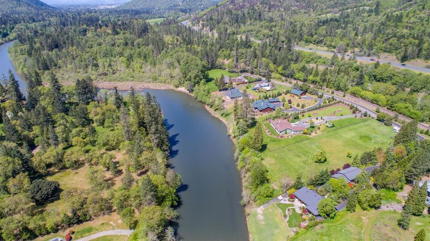 Grants Pass - custom home - building lot on the Rogue River. Comprised of 2.16 acres. Ideally situated just above Pierce Riffle. Wonderful neighborhood with gorgeous custom homes. Views of the mountains and the river. Site has a well installed plus irrigation rights from the river. Walking distance to Pierce Riffle Park. 15 mts to downtown Grants Pass.