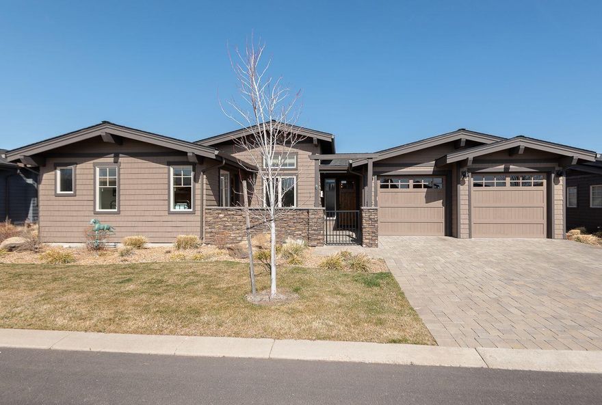 Beautiful single level, well appointed and impeccably maintained home at the Rim at Tetherow. It is light and spacious throughout with modern lines that are designed for effortless flow. Gated front courtyard leads to an open Great Room with soaring ceilings and built-in sound system, private den/office, custom cabinetry and stacked stone fireplace. The gourmet kitchen w/ adjoining dining area features a Thermador range, stainless steel appliances, walk-in pantry and gorgeous quartz countertops. Covered outdoor space with fireplace. Primary suite has a luxury bath, custom closets, heated flooring and soaking tub. 2 guest bedrooms with ensuite baths.  Three zone HVAC and 3 car tandem garage. For added peace of mind there is a security system and the roof has heated coils to prevent ice dams. Conveniently located near the clubhouse, fitness center, pools and restaurants with easy access to ski area, lakes, hiking and biking (Phil's Trail network). This is your Central Oregon dream come