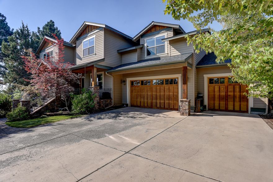 This beautiful Awbrey Park home is ideally situated near Sawyer Uplands Park and across from the Deschutes River Trail trailhead and natural park space. The main level with wide plank wood floors throughout includes a sunny great room with a gas fireplace flanked by built-ins, kitchen with concrete countertops, island with prep sink, pot filler faucet, double ovens, walk-in pantry, and an oversized bar with seating for up to six. The large adjacent dining area opens directly to the back covered patio and fenced backyard. The office with closet has easy access to the full bath, creating a 5th bedroom option. The upstairs includes a large primary suite with its own fireplace and spa-like bathroom including a tiled shower, soaking tub, dual vanities, enclosed toilet and walk-in closet. A junior suite, 2 additional bedrooms, a full bathroom, and bonus room with wet bar and attached half bath round out this desirable floor plan. This home on Bend's desirable west side is a must see!