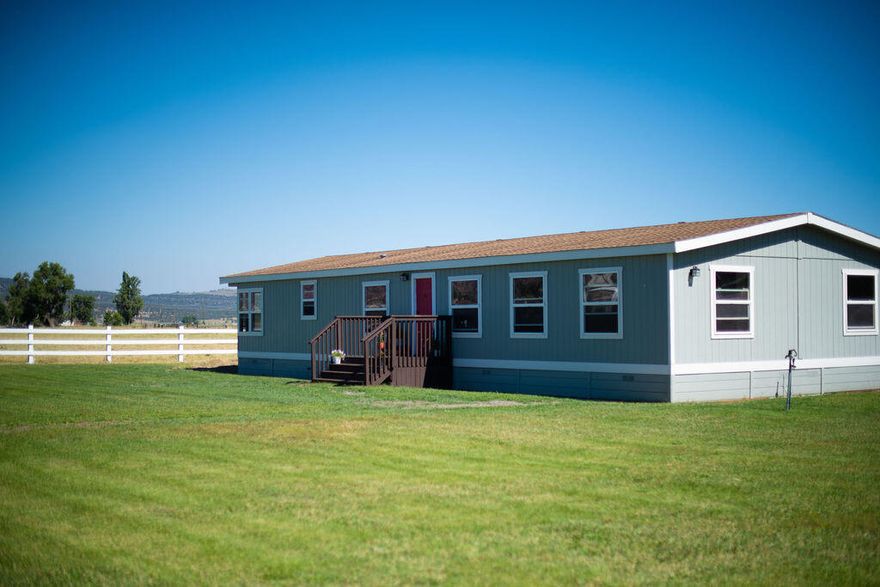 This is a wonderful 3 bedroom 2 bath manufactured home located in Malin, OR. This home sits on 2 acres along with a shop. Home features an open floor plan, living room, family room, dining area, primary bedroom bathroom, along with 2 bedrooms. Water rights are located on the property as well. Please call today this is a must see!