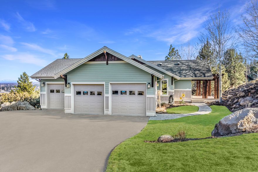 Perched above Bend, this contemporary craftsman home welcomes you with stunning easterly views and a front row seat to fireworks on the 4th of July. The completely updated gourmet kitchen includes marble countertops, new Kitchen Aid appliances and a Wolf range accented by under cabinet lighting. Both kitchen and great room are light-filled and accented with vaulted ceilings. French doors welcome you to the primary suite with new fireplace addition and hickory hardwood flooring. Primary bath has new solid surface countertops and more. The entire home features new interior paint, new counter tops, new window coverings, new windows and additional areas of new hardwood flooring. Downstairs you'll find a flexible bonus room and separate work out area. The 3-car garage is a dream come true with the addition of a gas stove in the work bench area, all new cabinetry, fresh doors and windows. The new paver walkway welcomes guests and the new fire pit sets the stage for entertaining.