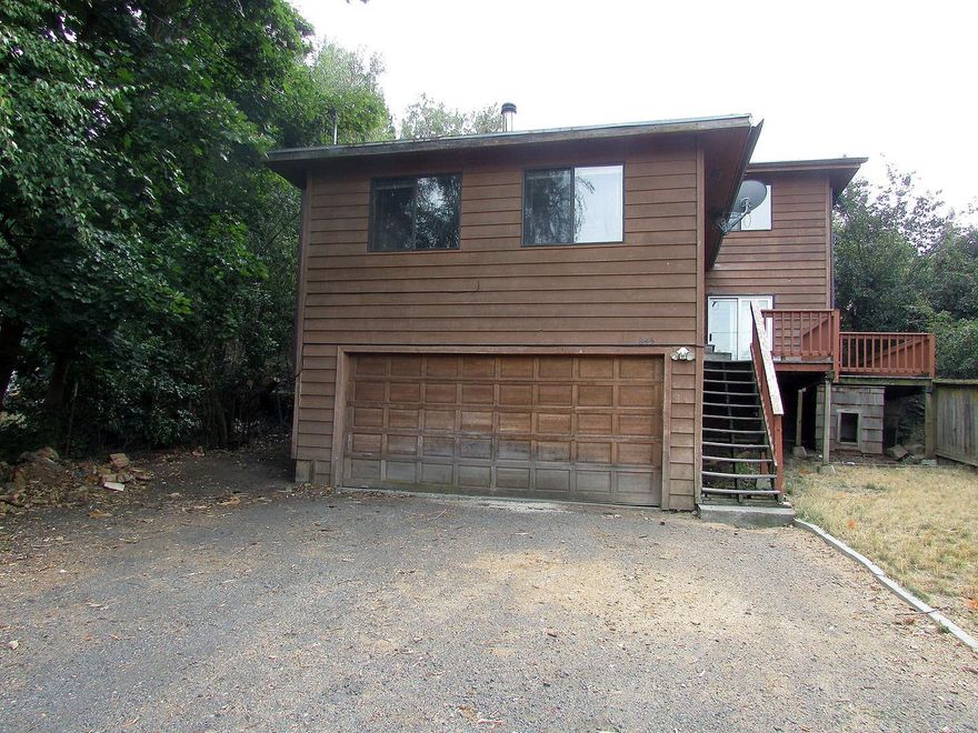 Classic tri-level home constructed to take advantage of the views of Klamath Lake and surrounding countryside. Lake views from the master bedroom, family room, living room, and bedroom #2. Extensive woodwork inside the home to include heavy beams throughout and solid knotty pine doors. Great two car garage with 220 electric and plenty of storage. Walk out from the family room to the Trex deck and watch the sun rise while sipping your morning coffee. With some updating this home could be a beauty.
