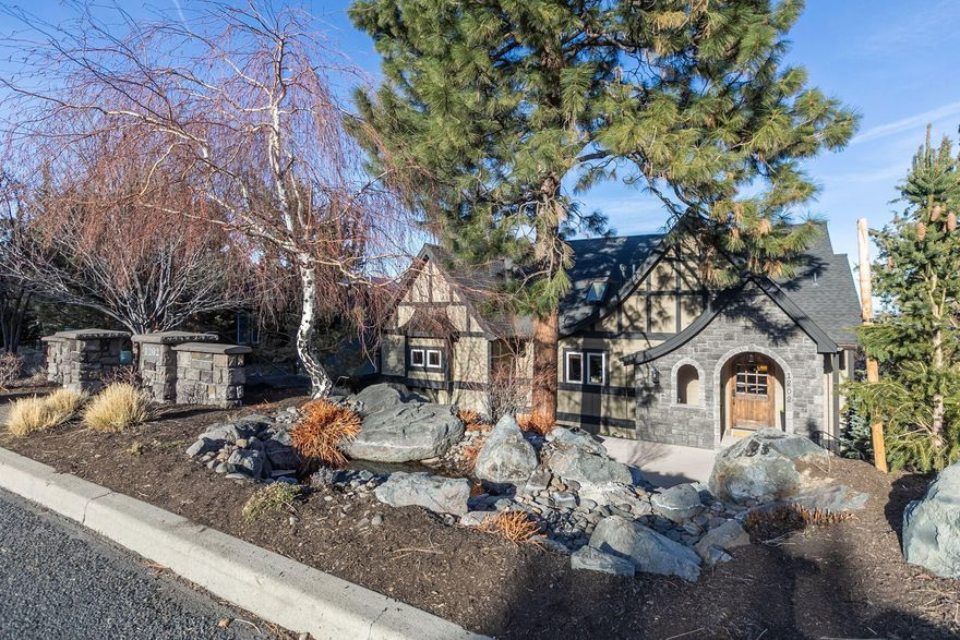 This stunning Awbrey Butte custom home stands apart from the moment you enter the charming private courtyard with a soothing creek & waterfall. The first thing you notice when you walk in the home is the remarkable 180-degree mountain views, including 3 Finger Jack, Jefferson, Hood, Black Butte, Adams and Gray Butte. Home has been recently updated w/ custom built-ins, stone fireplace, refinished walnut hardwood floors, & more. Open floor plan includes great room, office, kitchen w/ new high-end appliances, large island & high-end finishes. Primary suite is located on the main level w/ a spa like bath, radiant heated floors and spacious walk-in closet. The lower level includes additional bedrooms & large living space that can be used as a family room, 4th bedroom, home gym or additional office & features a separate entrance.  It has a kitchenette SubZero mini-fridge & built-in cabinetry. Rounding out this home includes loft level storage in the garage, Epoxy flooring & fenced backyard.