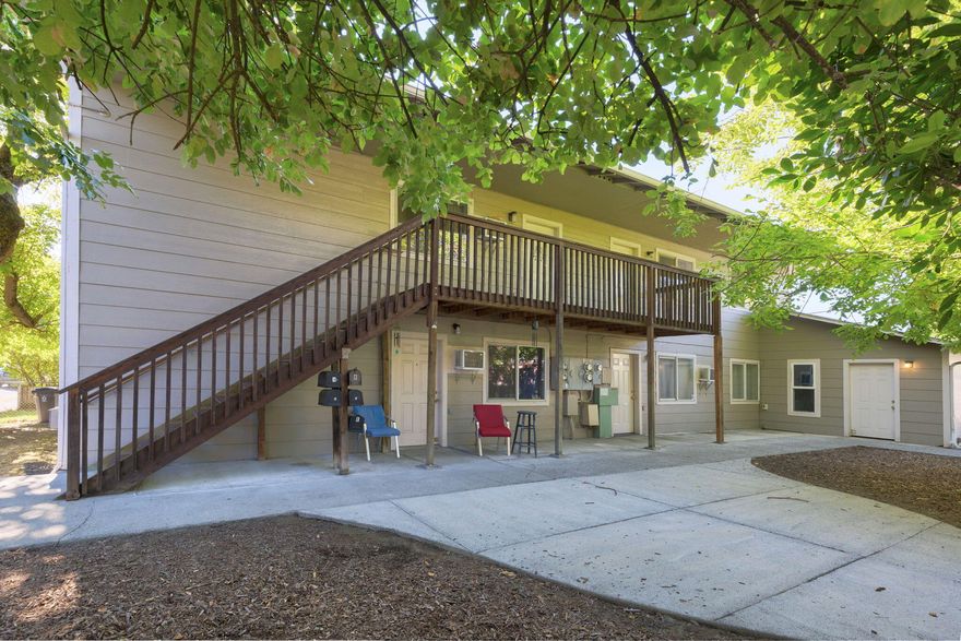 Close to downtown Grants Pass  on a nice quiet part of J St. This 4 plex has been held as an investment and maintained by the original builder since construction.   With alley access to private garages these 2 bedroom 1 bath apartments are in high demand!  Guests can enter through a shared courtyard off J St.   Intuitive floor-plans help each unit feel spacious and AC helps to keep everyone comfortable year round.  Both lower units have private backyards with patios.  Both upper units have private balconies with nice views of the valley.   A coin operated laundry room on the ground level adds an additional stream of revenue for the owner.  Looking to increase your investment portfolio? This could be a GREAT 1031 exchange opportunity!
If you have been thinking about purchasing an investment property make sure to check this one out today.