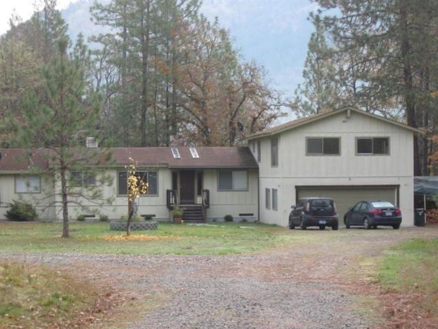 Come see this tucked away home that opens out for growing a garden and, or critter keeping. This 3 bedroom, 2 bath home has room for more completed rooms in this 3300 sf home. Started as a Mfg Home - it kept growing . . . The home is non-conforming and currently rents for $1200 a month with a small single-wide that rents for $500 a month. Owner willing to consider carrying the financing for a qualified buyer. Also available is the home adjacent to this property, MLS#2947392