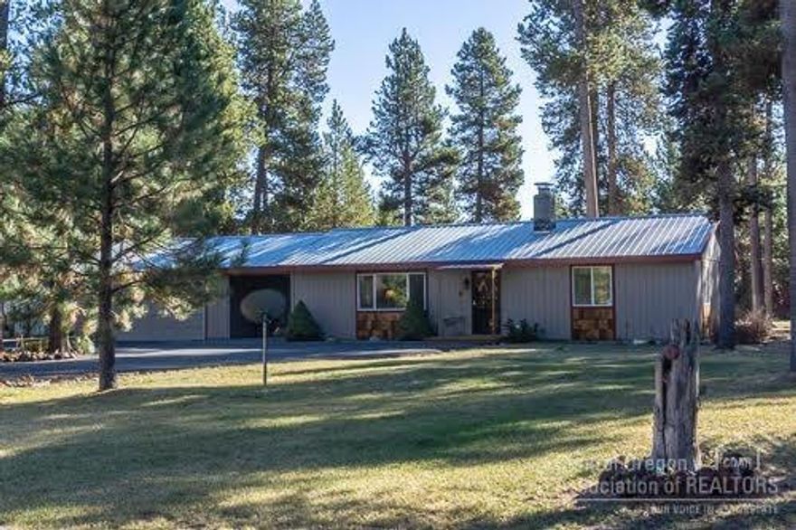 Darling single level home on an acre! Features living room with pellet stove, open kitchen with breakfast bar and separate dining area. 3 bedrooms, 1 updated bathroom, detached garage with utility room. Breeze way to access the garage. Fire pit, fully fenced, tall pines, storage shed, pump house, move in ready.