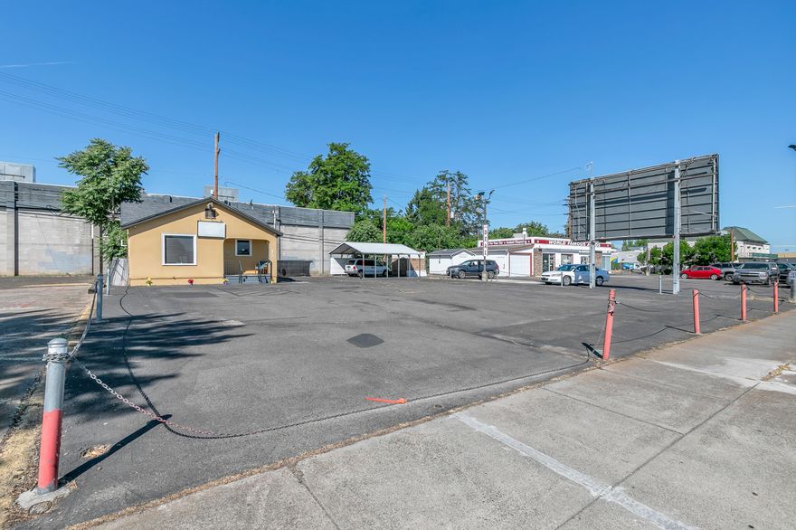 Prime commercial opportunity in a high-traffic location ideal for a car lot, retail store, or service-based business. This property features ample parking, excellent road visibility, and easy access, making it a standout choice for entrepreneurs and investors alike.