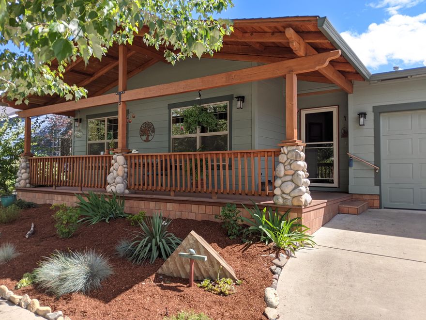 The love and care that's been maintained in this home is apparent.  Filled with natural light throughout, you are invited into the living room by wonderful garden views and an open entertaining area.  The kitchen opens into the entertaining area over tasteful granite countertops, and is filled with upgraded appliances including a double oven setup for those home chefs who enjoy entertaining.  The master bedroom also has vaulted ceilings, an abundance of natural light, and outdoor access, allowing magnificent flow, cross breezes and garden views throughout.  The en-suite bath has been updated and includes a spacious walk-in closet.  Only a six minute drive away, this private certified pollinator garden paradise is closer to Ashland's downtown plaza than many of the homes in Ashland while still providing the peace and quiet afforded by Talent.  Quiet, respectful, and friendly neighbors complete the feel of this neighborhood.  This home is a must see, single level living dream.