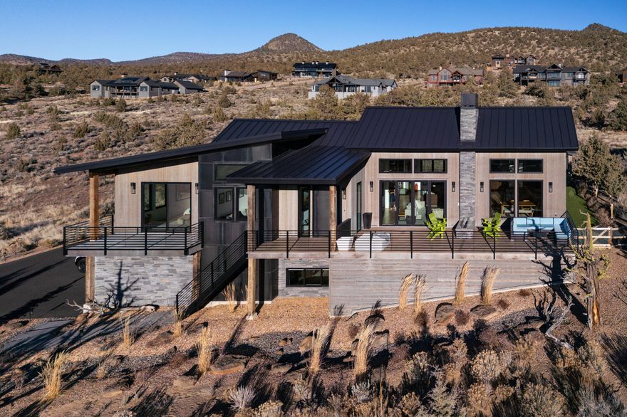 Elegant Pacific Modern with Breathtaking Views!
Welcome to a sanctuary of privacy and luxury at Brasada Ranch. This pristine home, surrounded by a vast common area, offers a secluded retreat with a grand primary suite, featuring a large walk-in closet and direct access to a private patio with a hot tub. The floor-to-ceiling windows and panoramic doors showcase the tranquil views, creating a seamless indoor-outdoor experience. The heart of the home is a spacious, light-filled area where the chef's kitchen, dining, and family room blend together, perfect for entertaining. Bypass the extensive building process and seize the opportunity to own one of the most coveted lots in the area. This highly customized residence is a rare find, offering a blend of luxury and comfort tailored to the most discerning tastes.
*30 E2 Solar Panels (owned) Panels can generate 90% of electrical usage 6 months of the year. Buyer to do due diligence.