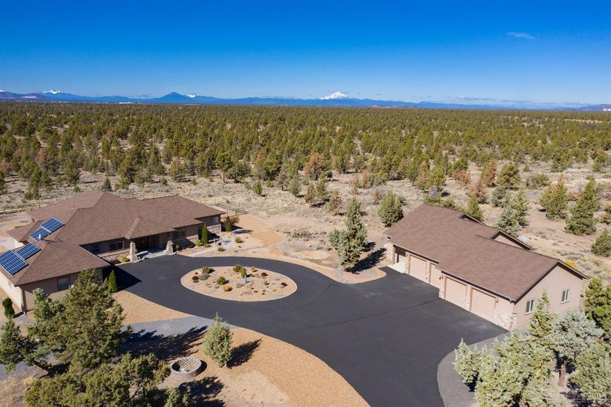 Looking for privacy? This 20 acre luxury property has panoramic Cascade Mountain Views sprawling across entire west facing back of home and property. This Baxter Built Custom Home is single level, 3247 Sq ft and offers 3 full suites. The guest house which is detached offers an additional 1000 sq ft, 1 bedroom 1 bath w it's own living room, kitchen area, laundry room and private patio. Home, guest house and 1700 sq shop are positioned perfect on the land for ultimate privacy, views, and full use of the land while backing BLM land for even more enjoyment. The 1700 sq ft shop is attached to guest house. Home offers an additional attached 2 car garage.