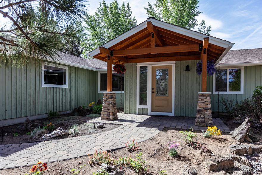 Beautifully updated single level home on a spacious half acre lot. Open floor plan with  hardwood floors, new quartz kitchen counter-tops, stainless steel appliances and a gas fireplace. The master suite features a tiled shower, large soaking tub and a huge walk in closet. Spacious bonus room and attached two car garage. Enjoy outdoor living in the park like backyard featuring: a large paver patio, koi pond, hot tub, greenhouse, raised garden beds, numerous fruit trees and berry bushes. Separate office /guest bedroom with outdoor entrance. High efficiency gas furnace and new central air conditioning.