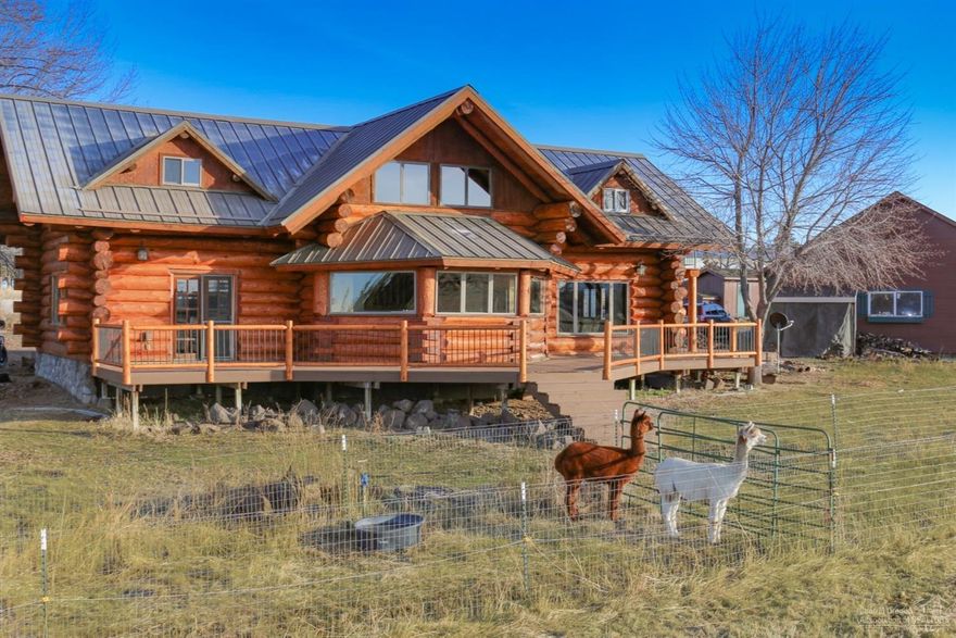 This beautiful custom log home was featured on HGTV's 'Log Cabin Living' as the premium Log Home choice of the current owner. This hard to find large acreage is located within Redmond's comprehensive plan for residential development. Features dynamic Cascade Mountain Views, Large Barn w/ room for stalls. Includes a Shop, Garage, Shed, Hay Storage, Auxiliary Buildings, irrigated pastures, fenced and cross fenced. Home has hardwood floors, granite counters, central A/C, wood burning stove, extensive decking, large Master w/ private balcony & more. A must see!