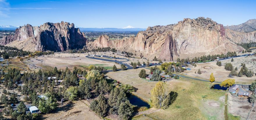 Million dollar views & a rare opportunity - affordable price! Situated across the street from the Smith Rock State Park Bivouc area, your view will never be lost. Epic rock formations frame Mt Jefferson & the Cascade Mtns. World class climbing & hiking just out your front door w/the privacy of country living. Vacation rental w/huge income potential as is. Or build your dream home adjacent to the State Park w/nature's splendor as your backdrop. Updated w/new windows, doors, floors, paint, bathrooms, kitchen, & 1200 sf wrap around deck. Outbuildings, garage, barn w/stall & storage, 2 Huts currently used as guest room & home gym, Greenhouse & more storage. 1 full hook up space for RV or Tiny home, w/potential for 2nd. Active irrigation rights w/two ponds for agricultural use w/fish & migratory birds. No HOA dues, affordable property taxes. Property zoned MUA w/endless business opportunities as allowed by Deschutes County. Future tax benefits available for investors!