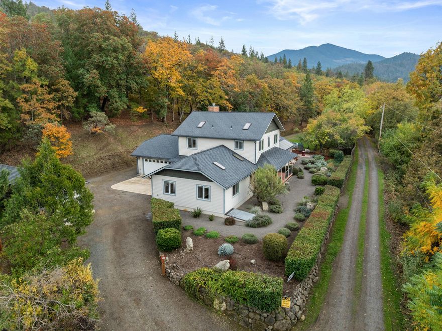 Tucked away on an exceptionally beautiful & private stretch of sought-after Rapp Lane, this property offers serene country living with modern efficiency. With 2,811 sqft, the home boasts 4 bedrooms + office and 2 bathrooms, attached 2-car drive-through garage, vaulted ceilings, skylights, radiant-heated wood floors, and more. The recently remodeled kitchen impresses with quartzite counters, huge island, farm sink, and Miele 6-burner gas range. The open great room includes a cozy gas fireplace and French doors to a covered flagstone patio with hot tub pad. Main level has 2 bedrooms+office, while upstairs has the primary suite with walk-in closet & luxurious spa bath with jetted tub. Enjoy peace of mind and low monthly costs with 8.6 kW solar panels + battery back up, solar hot water heater, EV charger plug, water storage tanks, whole-house filtration, and drought-tolerant landscaping + fenced ⅓-acre organic garden on drip system. An idyllic, energy-smart retreat just minutes from town!