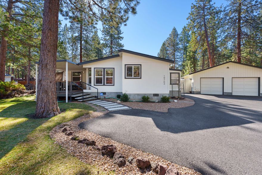 This beautifully updated home offers a bright, flowing floor plan designed for  comfort & style. The kitchen shines with SS appliances, a farmhouse sink, freshly painted cabinets, stylish new countertops, & plenty of workspace. The primary suite is a true retreat, featuring a luxurious new walk-in tile shower, double vanity, & heated flooring. Walk-in closets in every bedroom provide ample storage! Major updates include a new roof, tankless water heater, new windows with treatments, & fresh exterior paint. The versatile mudroom/sunroom is perfect for extra storage or a cozy relaxation space. The oversized 2-car garage includes a separate office/shop with its own entrance—offering endless possibilities. Outside, enjoy the new backyard patio, 2 storage sheds, & raised garden beds. The inviting front yard boasts fresh landscaping, refinished covered deck, & artistic privacy screens. A perfect blend of charm, modern updates, & functionality—don't miss this opportunity to make it yours!