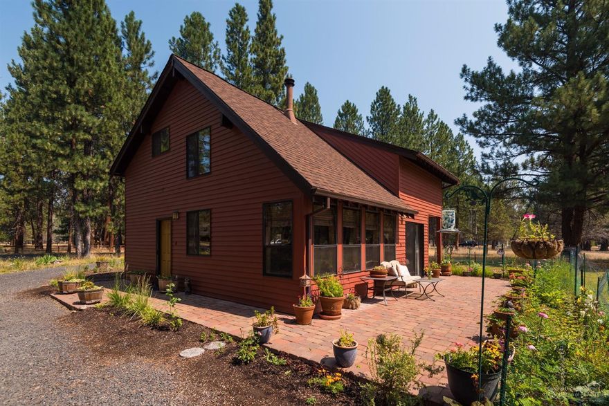 Sage Meadow Charmer -1212 sq. ft. on 1.08 acres & cul-de-sac with path access to forest trails! Open floor plan has living area with vaulted ceilings, dining area and kitchen. 2x6 construction, wood cedar walls & ceilings plus double-paned windows & wood blinds. New wood stove, 3-year-old roof & exterior paint. Portable A/C & Heater, 3-year-old washer, dryer and refrigerator all included. 4-year-old 12x12 shop on 1ft. centers w/ power. Paver patio, lawn, flowers & limbed up trees create a lovely setting.