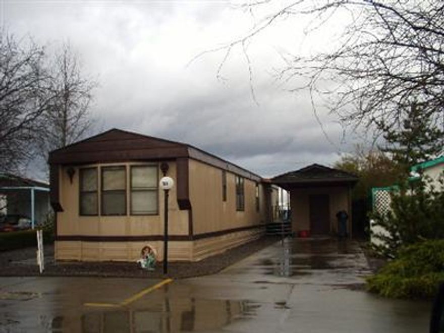 Well maintained home on quiet cul-de-sac lot in family park. Home has vaulted ceiling, open floor plan with front & rear bedrooms & baths. Spacious kitchen with snack bar, storm windows, lg master bath has oval soaker tub, separate shower & dual sinks. Sp rent of $360/month includes water. Sale includes washer & dryer. Yard is all low maintenance with storage shed behind carport. Home is priced below tax assessed value for quick sale. Park offers nice clubhouse with pool.