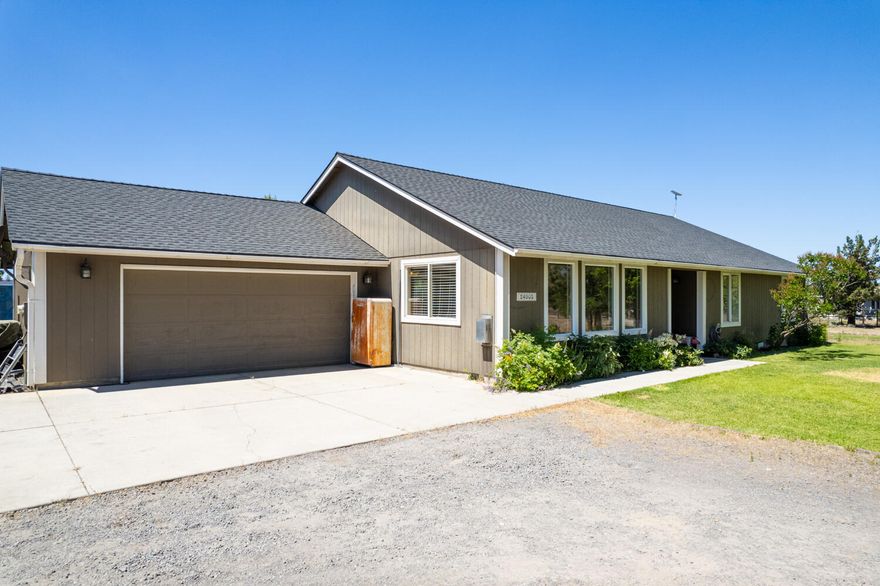 High desert living on 4.76 acres w/Cascade Mountain Views located on the outskirts of Bend! Property is gated & fully fenced w/area for horses and/or livestock. The single level ranch style home boasts 1,920sf of living area w/4 bedrooms & 2 full baths. The open floor plan seamlessly connects the living room, dining area, & kitchen, creating a warm & inviting atmosphere w/space to entertain. Large windows allow natural light to flood the interior, offering picturesque views of the surrounding property. Laminate flooring throughout the main living areas, vaulted ceiling, cozy corner gas burning fireplace, & large dining area + breakfast nook. Kitchen ftrs solid surface counter tops, full height backsplash, stainless steel appliances, pantry & plenty of cabinetry for storage. Out back you'll find a deck & patio area, firepit, two story playhouse & more for outdoor entertaining + year round enjoyment. Barnkit available for purchase outside of escrow. Bring your critters & toys; NO HOA!