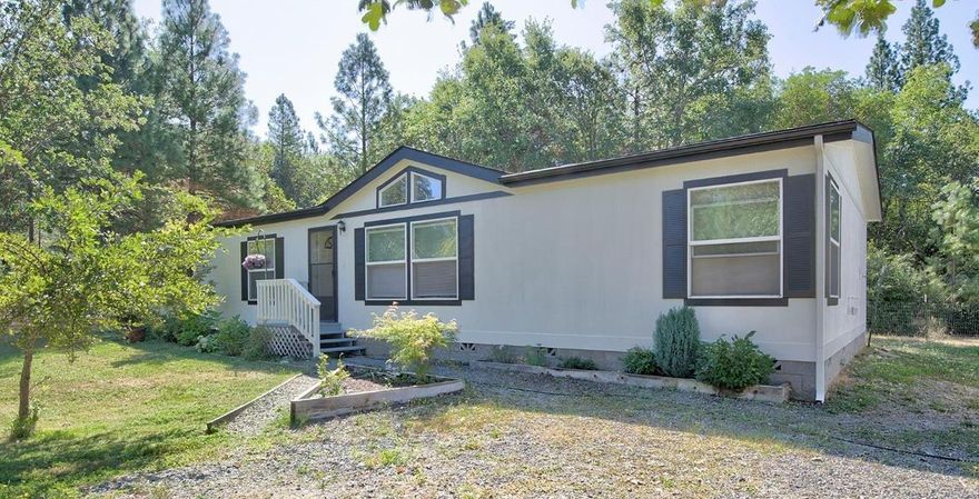 This country home is ready to be loved on by new owners. Flooring allowance means you can pick your own carpet and kitchen floor. The stove, refrigerator and dishwasher are brand new! Cabinets and walls have been freshly painted. There is a very large fenced garden ready for your care. Enjoy an iced tea on your covered back deck after you spend some time enjoying your garden. There's a detached garage and all the land is flat and usable. Call today for your personal tour.