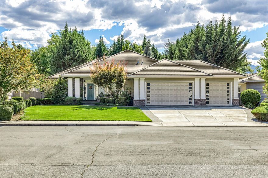 You'll fall in love with this gracious single-story home in the sought after Larson Creek neighborhood. Situated on a park like .31 acres, this 2481sq ft. home offers 3 bedrooms, 2 full baths plus a 3 car garage. Inviting entry features high ceilings, hardwood floors & is open to formal den & dining room w/alabaster light fixture. The great room open to kitchen & breakfast nook showcases a beautiful fireplace w/built ins & tray ceiling. A wall of windows & open floor plan makes this space perfect for entertaining. Inviting kitchen is spacious & bright w/white cabinetry, granite counters & gas range. Primary suite w/door to back deck is a retreat w/private spa like bath, double vanity & walk in closet. 2 additional bedrooms & a full bath at the end of a wide hallway w/hardwood floors. Bedrooms feature plantation shutters. The backyard oasis is a well thought out space w/lovely deck to take in easy care backyard & the creek beyond. Close to medical, shopping, dining plus 3 car garage!