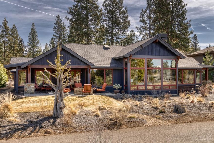 This stunning Norman Building and Design home offers views of Broken Top and the Three Sisters mountains from its tucked-away location in Tetherow. A long, flat driveway off the cul-de-sac allows for plenty of privacy. Inside this single-level home find custom accents throughout, including alder soffitting, Engineered European white oak floors, and 8-foot alder doors. The great room features a gas fireplace, 20-foot ceilings, and a wall of windows that open to views of the 12th fairway and green and the mountains beyond. A patio off the great room has a built-in firepit for chilly Central Oregon evenings. The gourmet kitchen features a commercial-grade gas Wolf range, two ovens, and a farmhouse sink plus additional prep sink. Quartz counters and a tile backsplash flow throughout the kitchen, and all soft-close cherry cabinetry is custom. A built-in, paneled 30 freezer and 36 refrigerator blends into the cabinetry. A large dining area off the kitchen leads to the patio.
