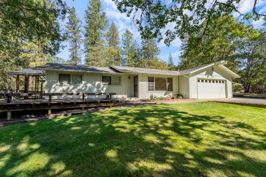 Welcome to 857 Azalea Dr! This wonderful country home is nestled amongst the prettiest nature backdrop on a beautiful 2.5 acre lot and only minutes from town! This property has been extremely well cared for and boasts a lovely and accommodating 1442 SqFt home with 3 bedrooms, 2 baths, a fireplace for cozy evenings, and endless peace + tranquility from the wrap around porch w/ screened-in sunporch and/or greenhouse areas. There is a nice sized two car garage, RV/boat parking, a brand-new 30-year roof as well as recent updates such as, new gutters, exterior paint, kitchen range, sprinkler system and HVAC all within the last few years. Kitchen boasts granite counters, solid wood cabinets and overlooks the lush park-like backyard. This property will make you feel right at home, it is welcoming, beautifully kept with the perfect blend of country living with convenience to city amenities and suitable for just about any buyer! Call today to schedule a tour!