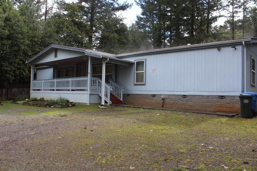 Financeable! 1993 double wide manufactured home is in a quiet neighborhood of Cave Junction on a street that gives it a private setting. 4 bedroom 2 bath home with a split floor plan, approx. 1440sqft. The foundation was installed in 2004 and also the front and back decks. The master bathroom was refinished with a step in shower and a new composition roof in 2016. The garage has been enclosed and used for storage but may be able to be converted back. Room for RV parking and gardening. This home is in move in condition and ready for it's new owners!