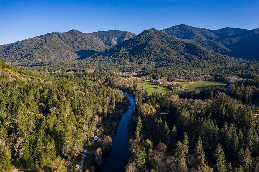 Rare, Unique and Highly Desirable 21.3 acres Along the Inviting Applegate River !!
This Exceptional Parcel has been a Family Gem for 4 Generations. Endless Potential. Create Your Own Oasis. Many Pristine and Beautiful Home-Site Possibilities to Build your Dream Home--In the Woods for Grand Mountain Views or Down by the Serene and Flowing Applegate River. Relaxation or Adventure Awaits: Swim, Fish, Hike, Explore, Hunt, or Experience Nature and Wildlife--You Get to Choose ! Remote and Secure behind 2 Locked Gates.  Easily Accessible by a Pleasant Country Lane, and Only a Short Drive Back into Civilization for Work, School, and Shopping. Close to Northern California and Southern Oregon Coasts, Oregon Caves and Ashland Mountain Ski Resort.  Come Explore all the Beauty, Adventure and Opportunities that Southern Oregon has to Offer. Sale Includes a 1984 5th Wheel 'King of the Road' Travel Trailer. Buyer to do their due diligence for use and development.