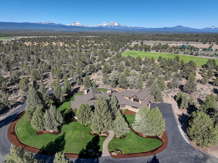 End of the road privacy, endless elbow room, enormous shop, & Cascade Mountain views throughout this 4300sf custom High Desert Home. 7.26ac property features an inviting residence w/ open floor plan, vaulted ceilings, large windows, chef's kitchen, 3 main-level suites, office, ample storage, & large bonus room perfect for playroom, crafts, guests, TV, or a 4th bedroom; also 4-car attached garage, greenhouse w/ power & water, covered front & back paver patio w/ hot tub, water feature, & 50-year comp roof. Insulated-heated shop with 4 bays, loft storage, separate bonus space w/ full bath, & additional garage on back. All this along with peace & quiet, adjacent to BLM land to explore, and ideally located for easy access to Bend, Redmond, & Sisters.