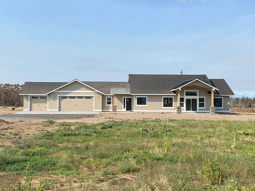 Views Views Views!!! This Fantastic New construction home offers an open floor plan concept and provides lots of natural light from the oversized windows.  Enjoy the high end finishes and a huge oversized 3 car garage that has 1076 sq feet of space. Located just four miles from the Downtown City of Redmond this area is a prime location.  Plenty of room for all the toys and room for animals to roam on 4.98 beautiful acres. Three acres of water rights with pressurized irrigation and connections located conveniently all over the property. The wide open spaces offer picturesque views of Smith Rock State Park and MT. Jefferson. Come make this fantastic home yours today.