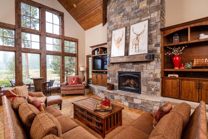 Custom Pineriver Homes built residence w/ golf course views in Caldera Springs!  Open floor plan includes a gourmet kitchen w/ chiseled edge granite, coffered wood ceiling, copper sink and high end appliances. Dining area w/ bar, distressed hickory hardwood floors, vaulted tongue and groove wood ceilings in the great room and floor to ceiling stone/gas fireplace w/ built ins. Spacious mud/laundry room leads to a 3-car garage w/ epoxy floors and built in cabinets for storage. Master on the main level plus an office (could be converted into a master suite). Upstairs you will find 2 additional bedrooms plus a bonus room (could be converted into a bedroom/bunk room). Wonderful outdoor space overlooking the golf course includes built in BBQ area, paver patio and fire pit. Central vac, 4 zoned heating, wood windows, new exterior paint and much more. This home is quality throughout. Start making memories in this Caldera Springs home!