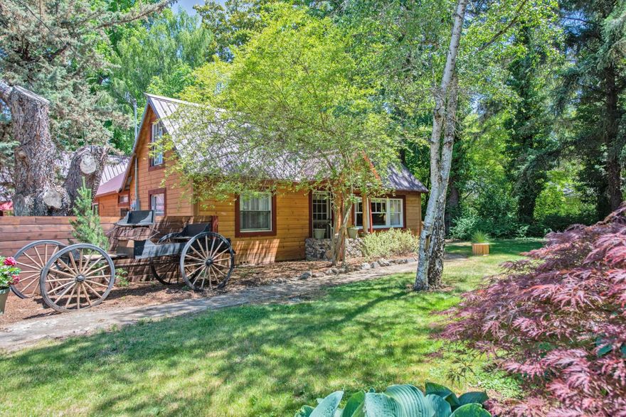 Charming property just off Beall Lane & close to Old Stage Rd. Country setting w/2 legal homes + 2 studios w/ baths. 2.50 acres w/over 2 irrigated acres through MID, year round creek runs through property w/walking bridge to barn w/ 3 stalls hay barn + tack rm. Field in back that is fenced & cross fenced. 3 carports + garage, workshop, RV parking pads w/ full hook ups.  Beautiful private landscaping w/ mature trees & a country feel. In ground sprinklers for landscaping & raisers to water the field. Main home has 3/2 + bonus rm, sunrm, hot tub, master w/walk in closet, jetted tub & shower, open kitchen & eating bar to dining rm & living rm, office/craft rm of 2nd bdrm. 2nd home has its own driveway. 2/2, garage & storage/workshop area. Chicken coop. Charming horse property close to town.