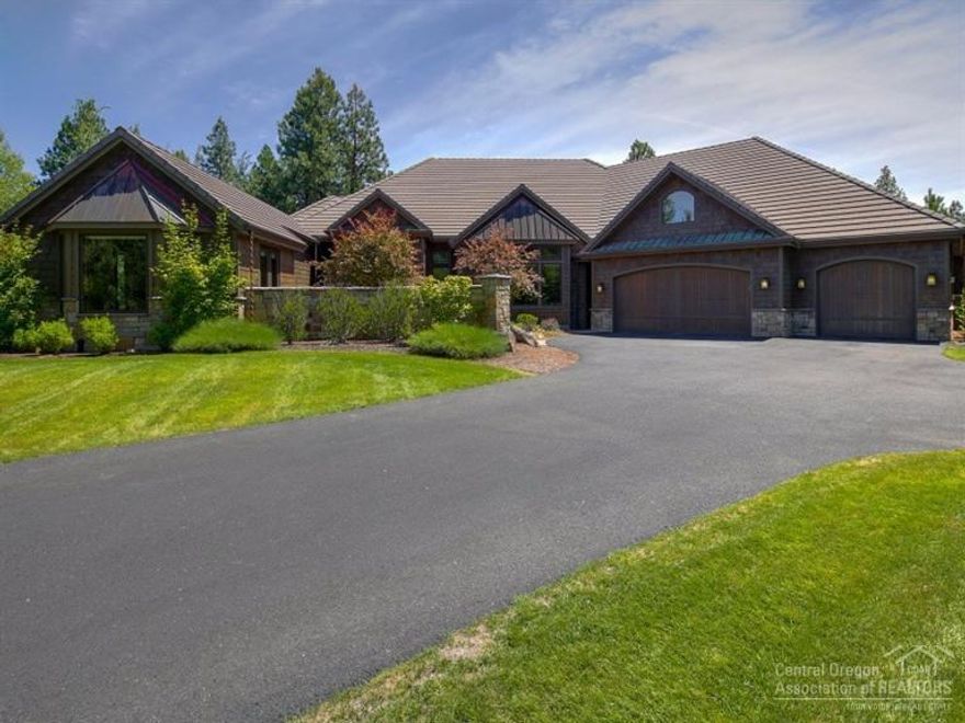 Sited amidst the tall ponderosas on a quiet cul-de-sac in the gated Broken Top golf community, this special custom home by Artisan Homes boasts classic NW detail & superior construction & finishes. Exterior offers a melding of wood, stone & copper. Open great room floor plan w/ focus on stunning views of Clubhouse, & full tee to green vistas of the 1st hole. Stone fireplace, chef's kitchen, hardwood floors, large den. Mostly single level living, w/good separation of bedrooms. Bonus room over 3-car garage.